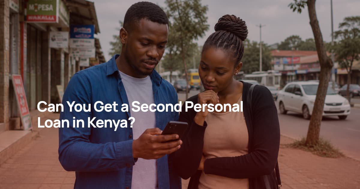 Kenyan couple looking at a smartphone while comparing second personal loan options.